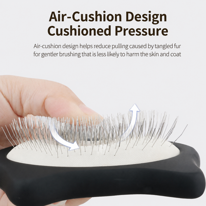 Close up of black pet slicker brush showing air-cushion pad and metal pins