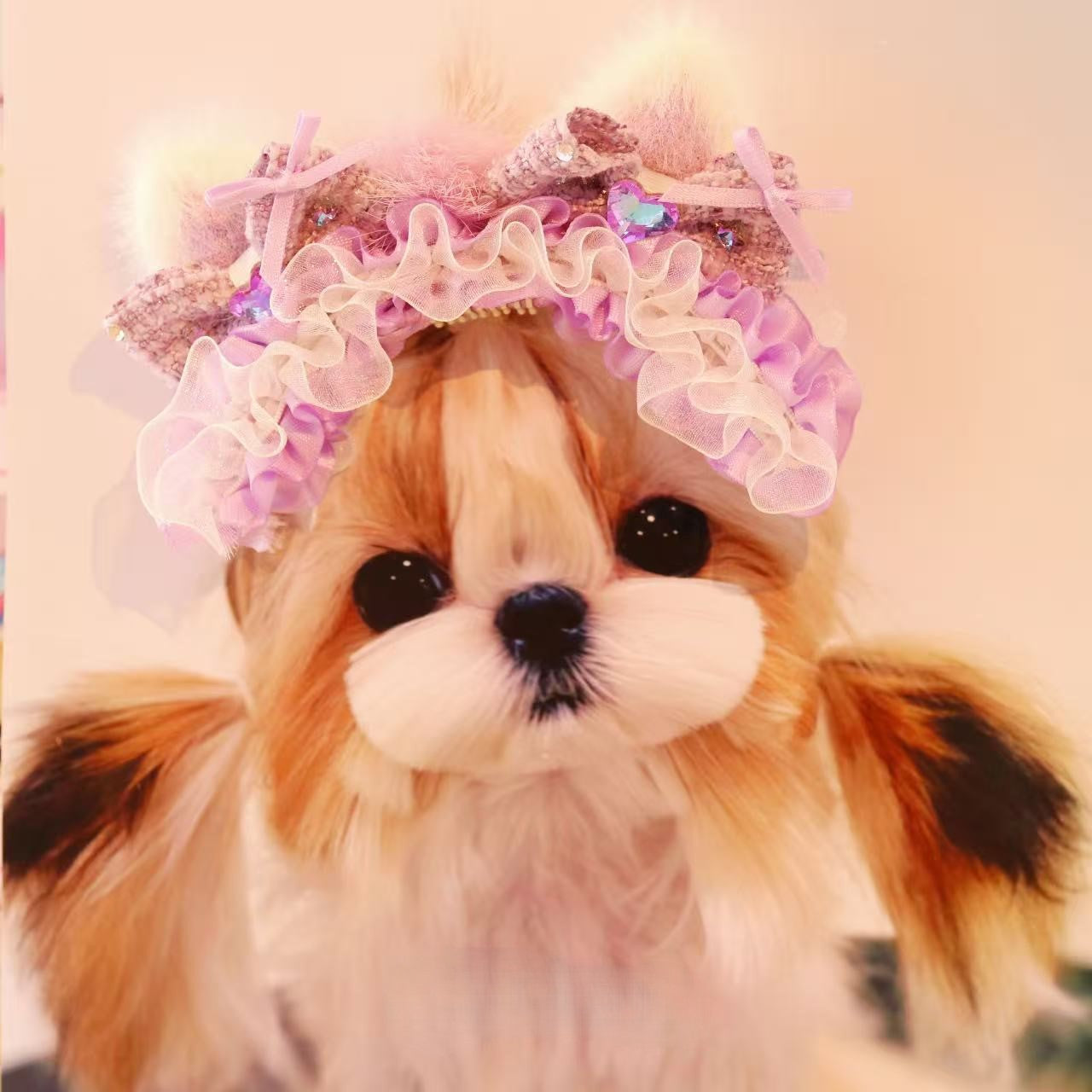 Dog wearing pink ruffled pet headband with textured bows and crystal accents