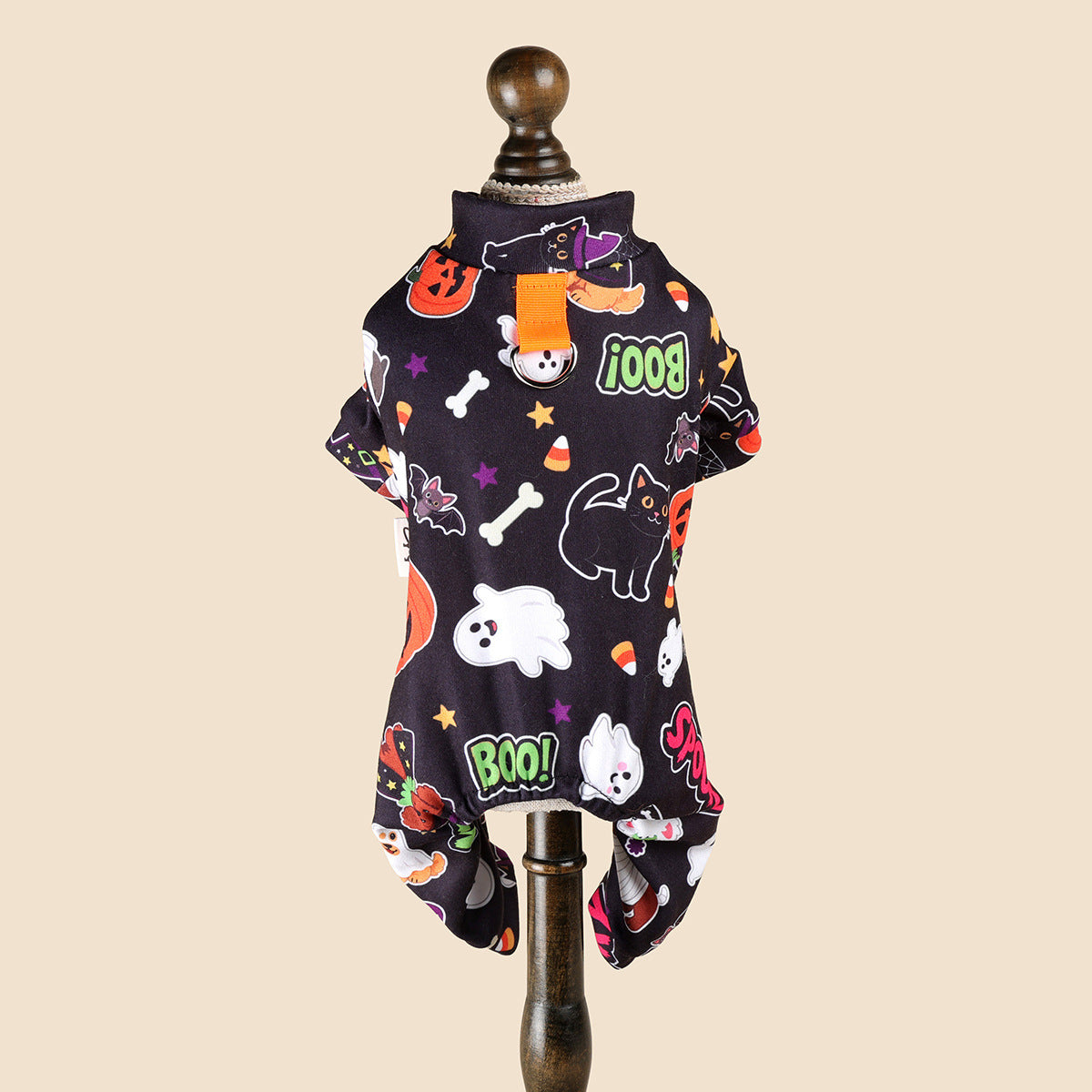 Back view of Halloween pet pajamas showing orange tab metal ring and four-leg shape