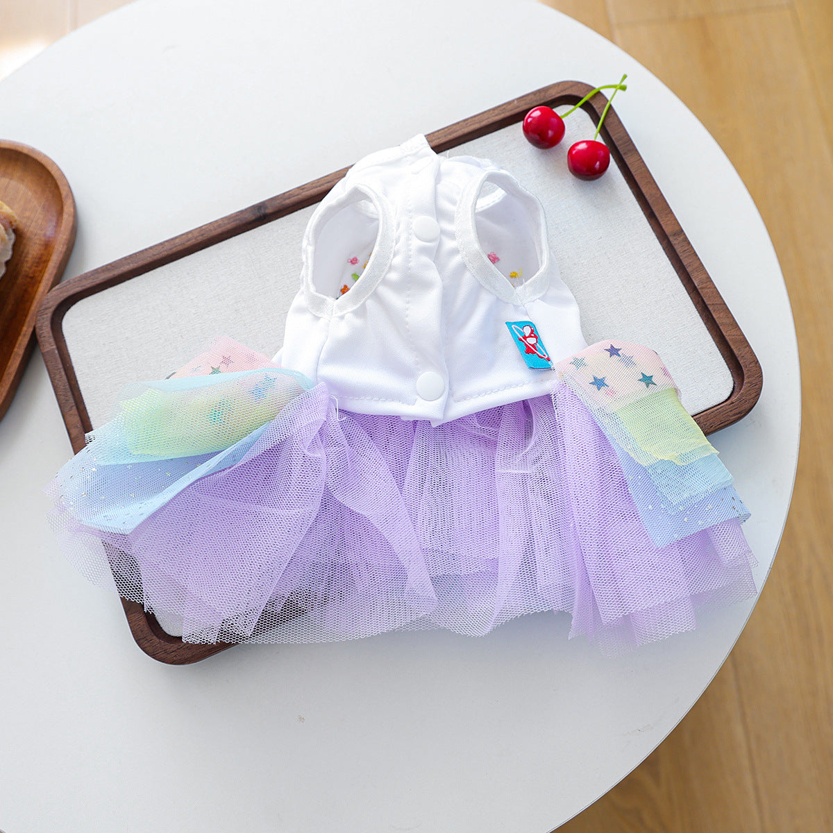 Happy Birthday rainbow tulle pet dress laid flat with white bodice and pastel skirt