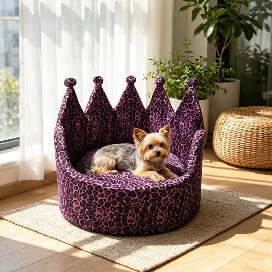 Small dog resting in a purple leopard-print crown pet sofa bed by a window