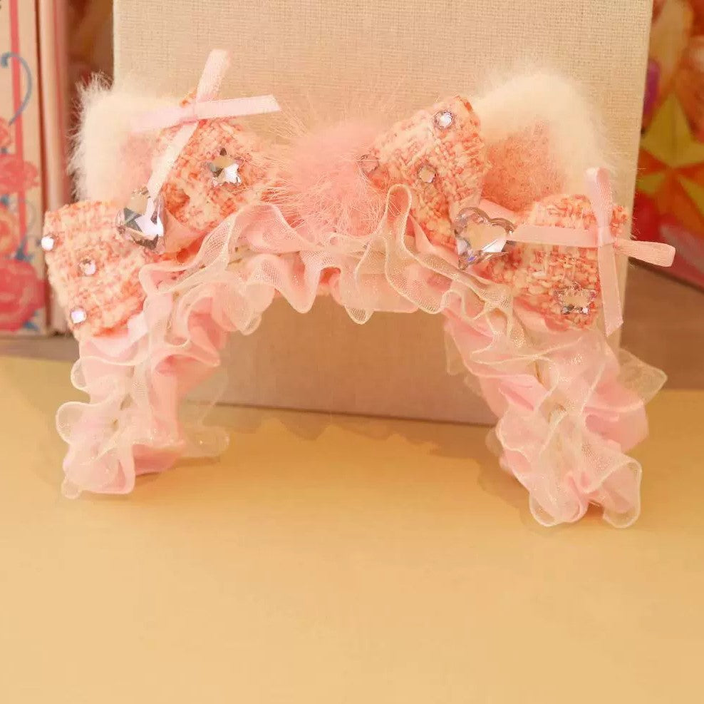 Pink and ivory ruffled pet headband with bows, fluffy trim, and crystals