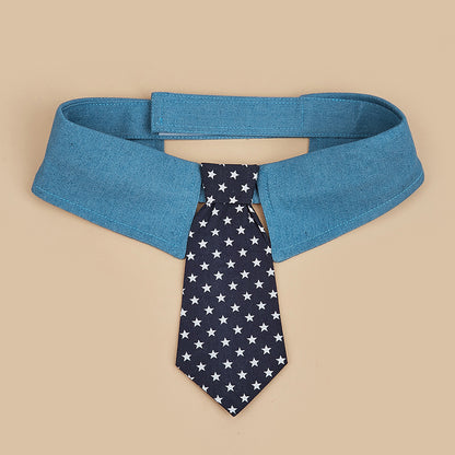 Front view of blue dog collar tie featuring navy necktie with white stars and adjustable fastening design