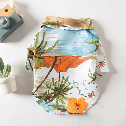 Flat lay of the orange tropical Hawaiian dog shirt with palm tree print