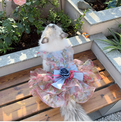 Cat wearing pastel floral short pet dress with bow and flower accents