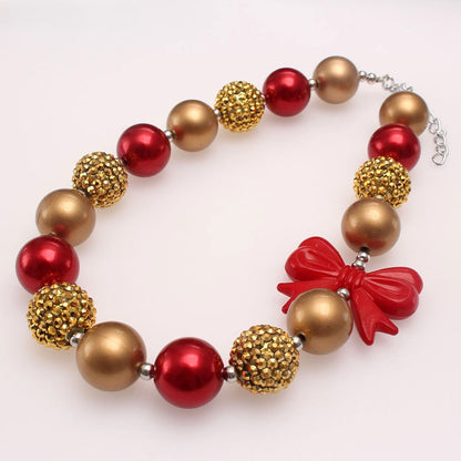 Red gold and bronze acrylic beaded dog necklace with red bow accent
