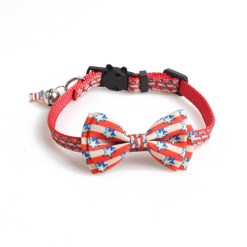 Close view of red patriotic star bow tie cat collar with bell and adjustable buckle