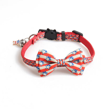 Close view of red patriotic star bow tie cat collar with bell and adjustable buckle