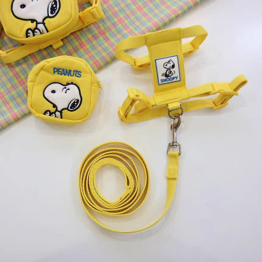 Yellow dog backpack harness set with leash and adjustable straps shown flat