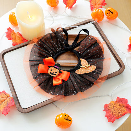 Black and orange pumpkin witch hat pet ruffle collar on tray