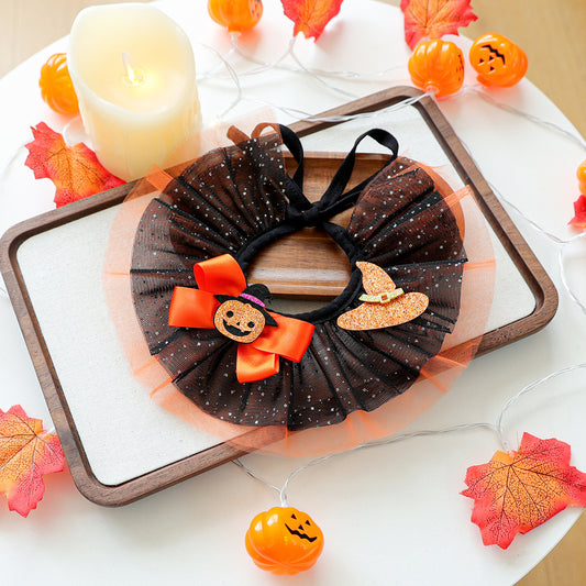 Black and orange pumpkin witch hat pet ruffle collar on tray