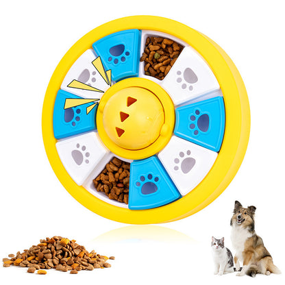 Yellow round dog puzzle feeder toy with blue and white paw print treat covers