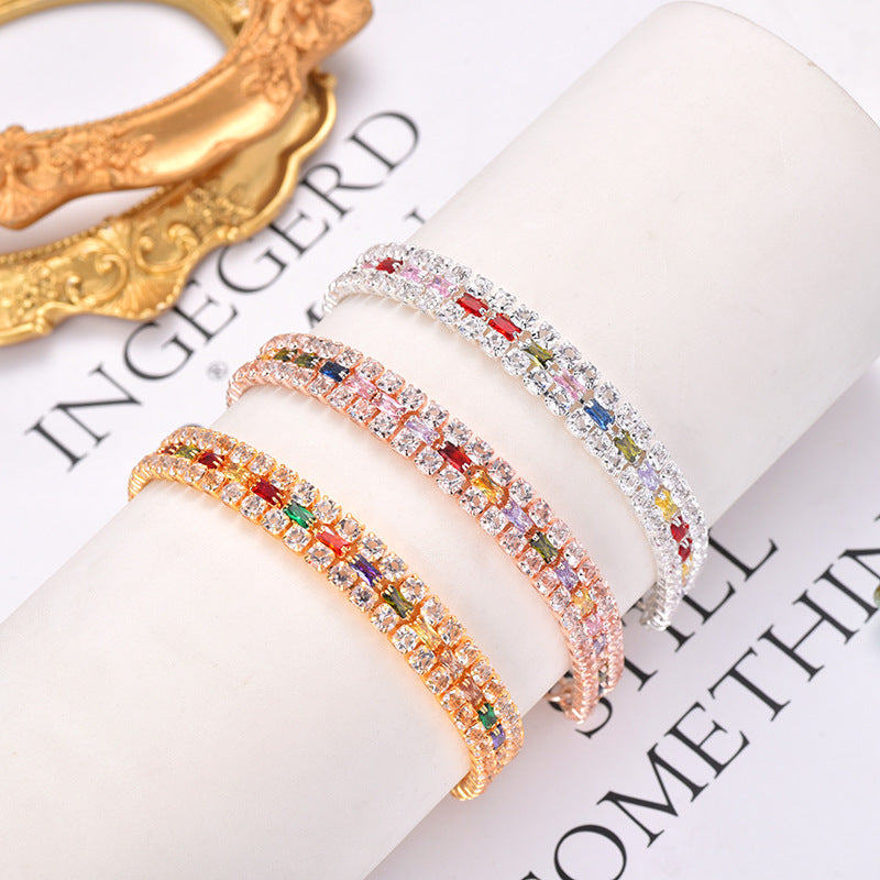 Rose-gold-tone and silver-tone multicolor rhinestone pet necklaces displayed on stands