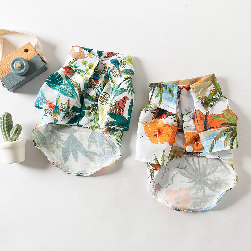 Front view of green and orange tropical dog shirts with button-front collars