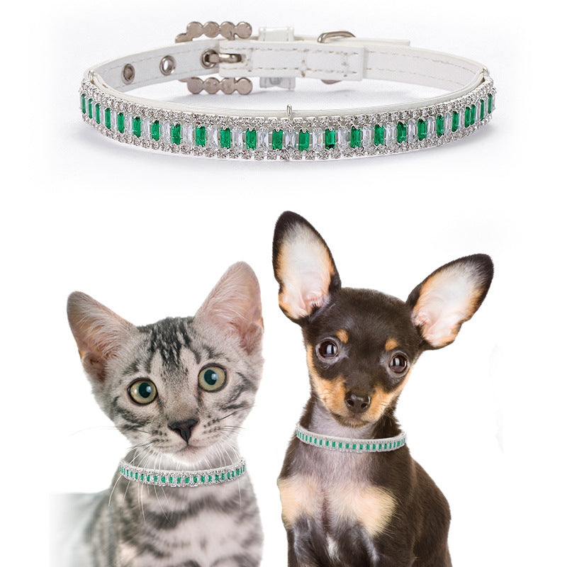 Luxury emerald crystal collar displayed on a cat and small dog for size reference