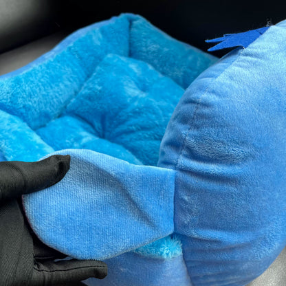 Detail of the pink-lined Stitch ear on the blue character pet bed