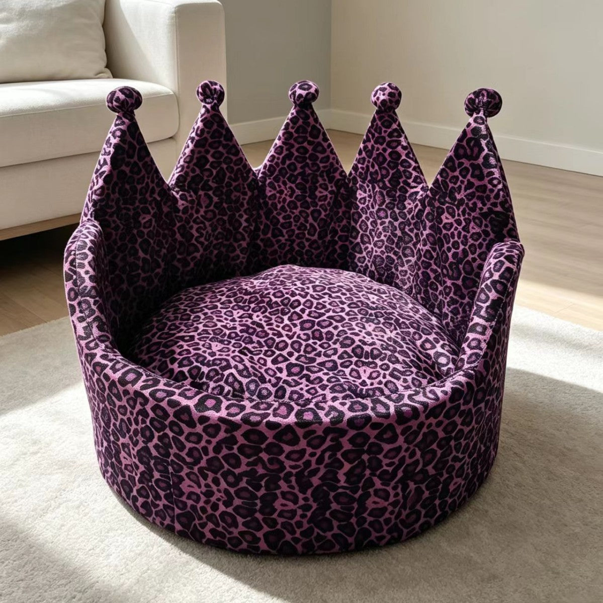 Purple and black leopard-print crown pet sofa bed shown in a living room