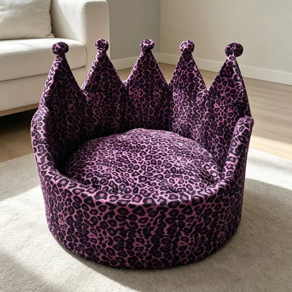 Purple and black leopard-print crown pet sofa bed shown in a living room