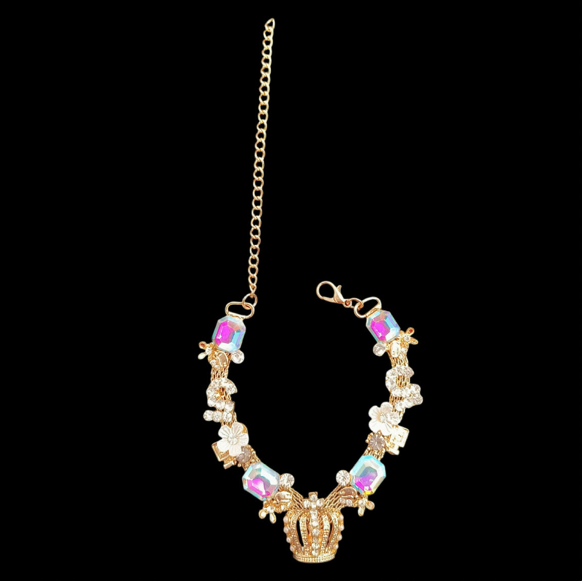 Gold crown pet necklace full view on black background with adjustable chain, clasp, flower accents, and iridescent stones