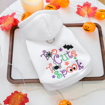 White Halloween pet hoodie laid flat with colorful Too Cute to Spook embroidery