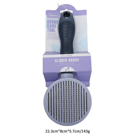 Round gray self-cleaning pet slicker brush displayed on packaging