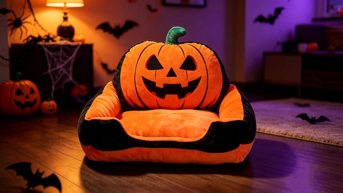Orange jack-o'-lantern Halloween pet sofa bed in a decorated seasonal room
