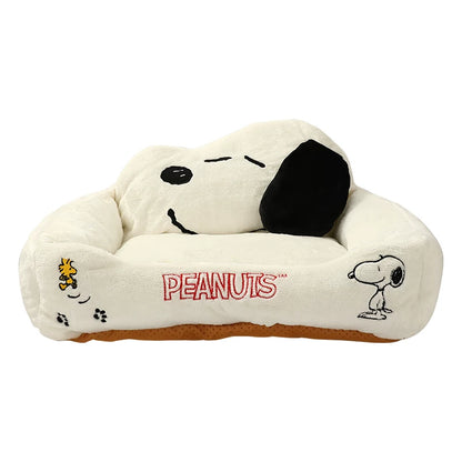 White Peanuts Snoopy plush pet sofa bed on a plain background