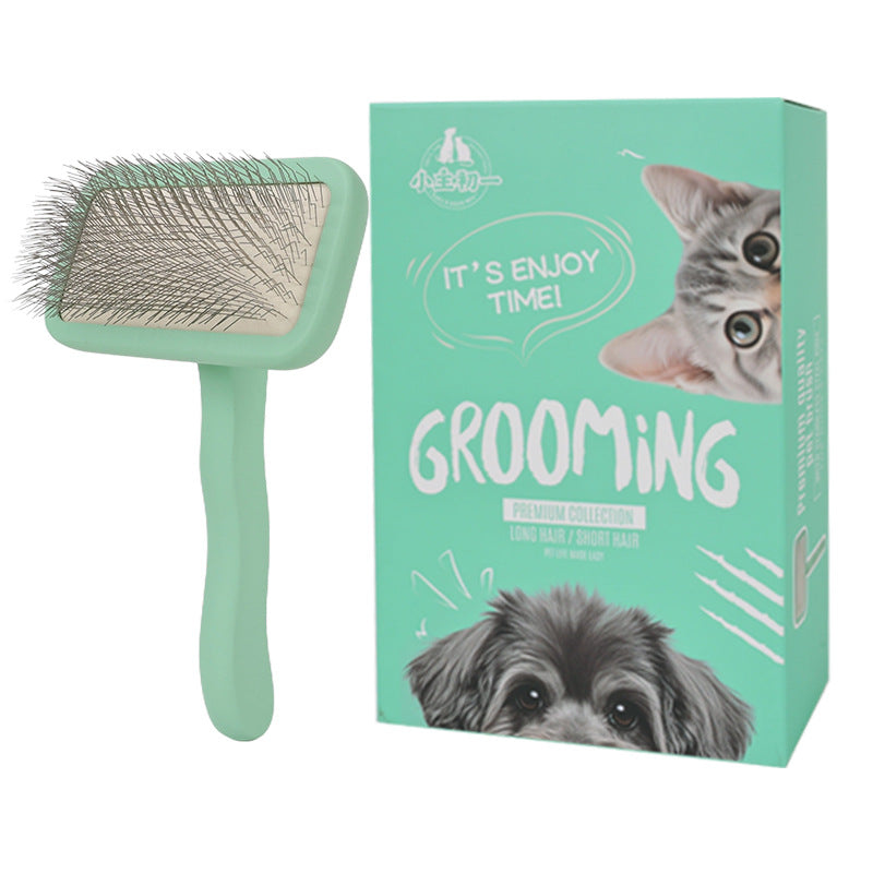Large mint green pet slicker brush shown with grooming box