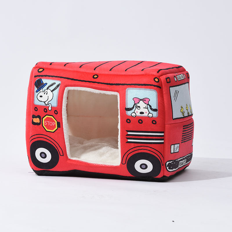 Red cartoon bus pet house bed with a wide side entrance and cream interior