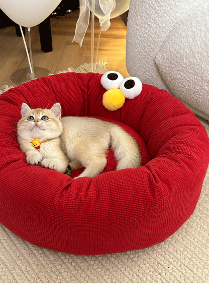 Monster Face Round Bolster Cat Bed - cat resting in red bolster bed - image 4