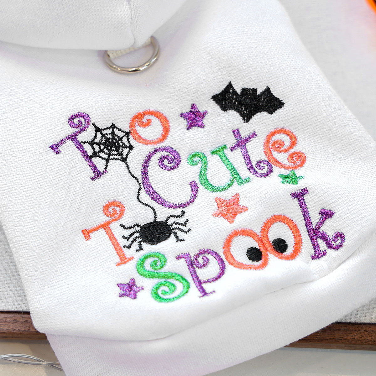 Close-up of multicolor spider bat and lettering embroidery on white pet hoodie