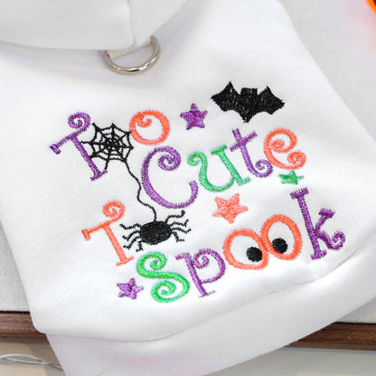 Close-up of multicolor spider bat and lettering embroidery on white pet hoodie