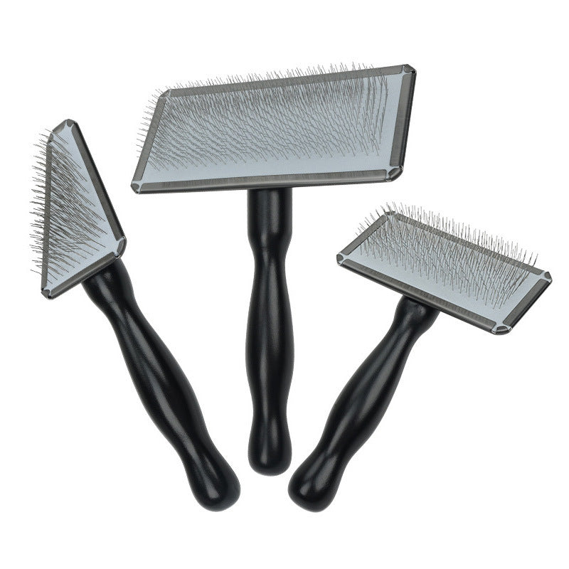 Three black pet slicker brush sizes with metal pins on white background