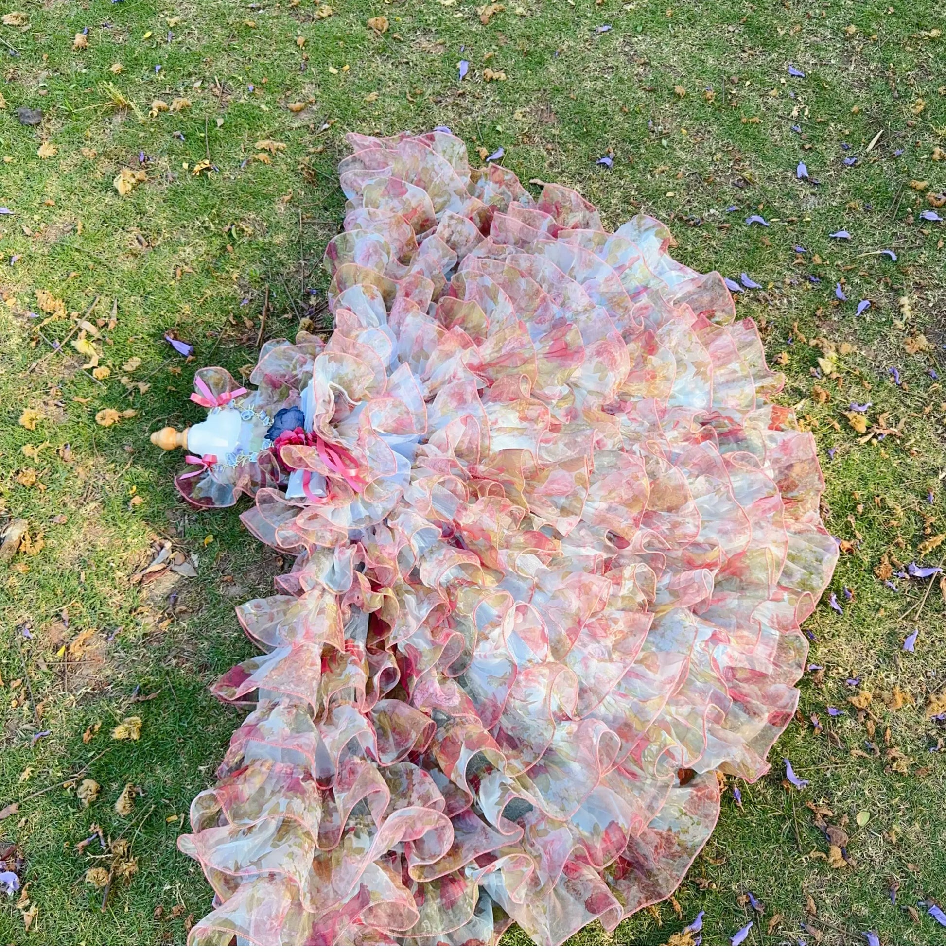 Pastel floral tulle pet dress shown with detachable ruffled gown on grass