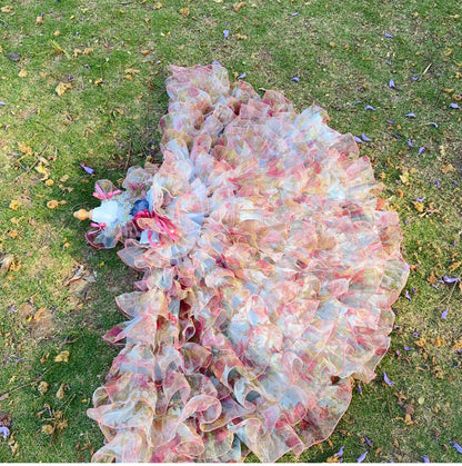 Pastel floral tulle pet dress shown with detachable ruffled gown on grass