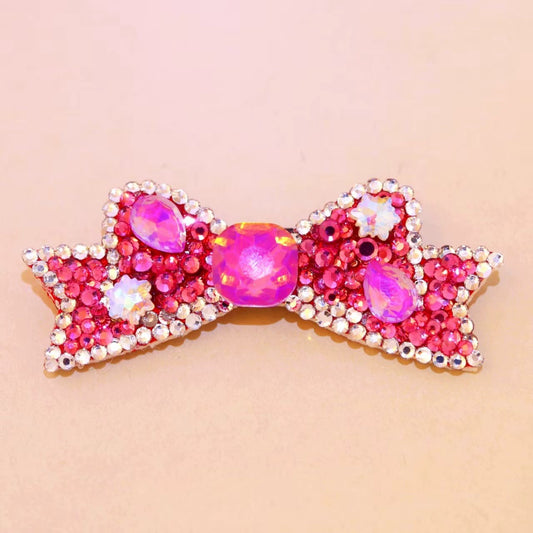 Hot pink crystal rhinestone bow pet hair accessory with iridescent accents