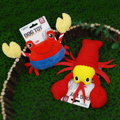 Lobster and crab plush dog toy styles displayed together on green background