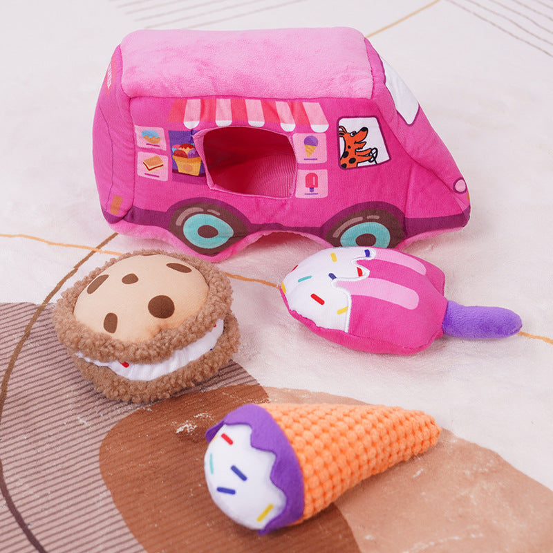 Pink dessert truck with three removable plush dog toys displayed in front