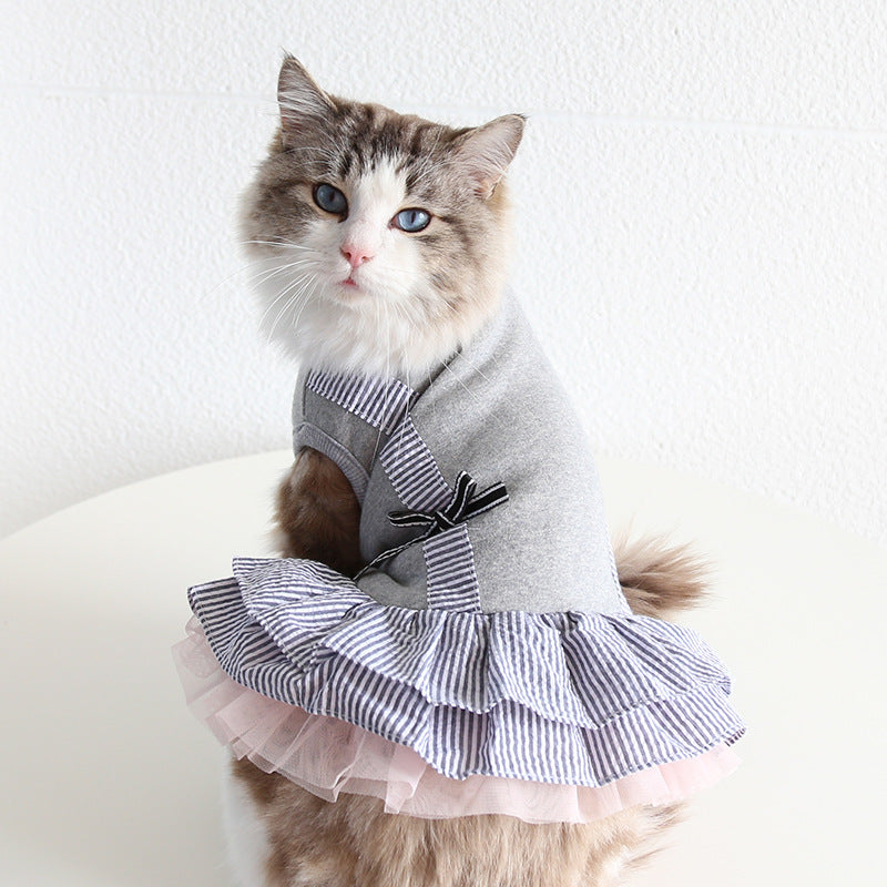 Cat wearing gray striped suspender pet dress with layered pink tulle