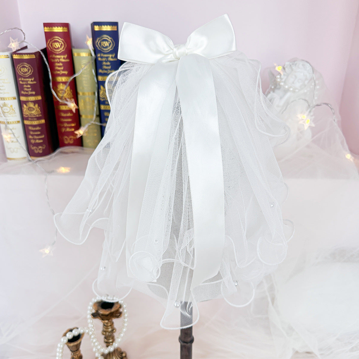 White layered tulle pet veil with large satin bow