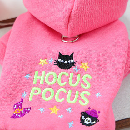 Close-up of black cat witch hat stars and Hocus Pocus embroidery on pink pet hoodie