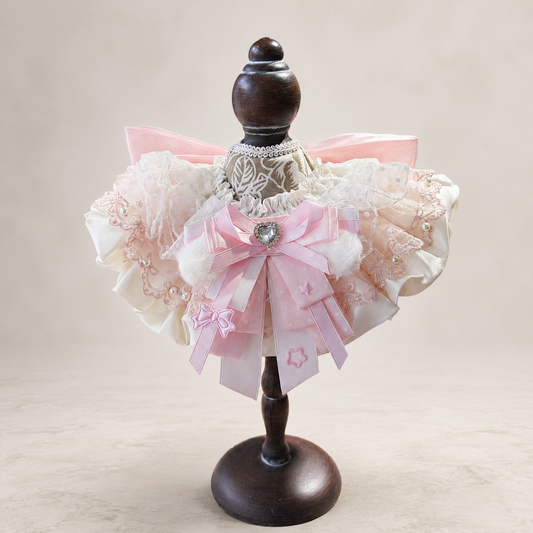 Front view of pink satin lace pet bib collar with ivory ruffles pearls and ribbon bow