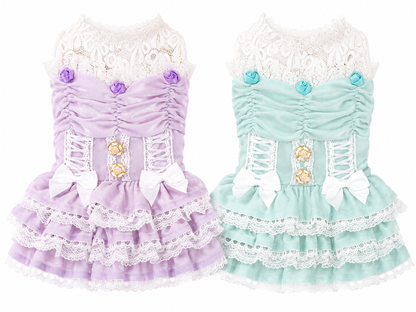 Small Maltese wearing lavender luxury lace princess dog dress in a spring garden setting