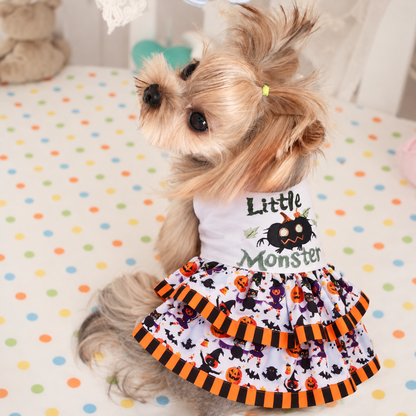 Small dog modeling the Little Monster Halloween dress with layered ruffle skirt