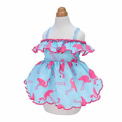 Front view of the blue and pink flamingo dog dress on a mannequin