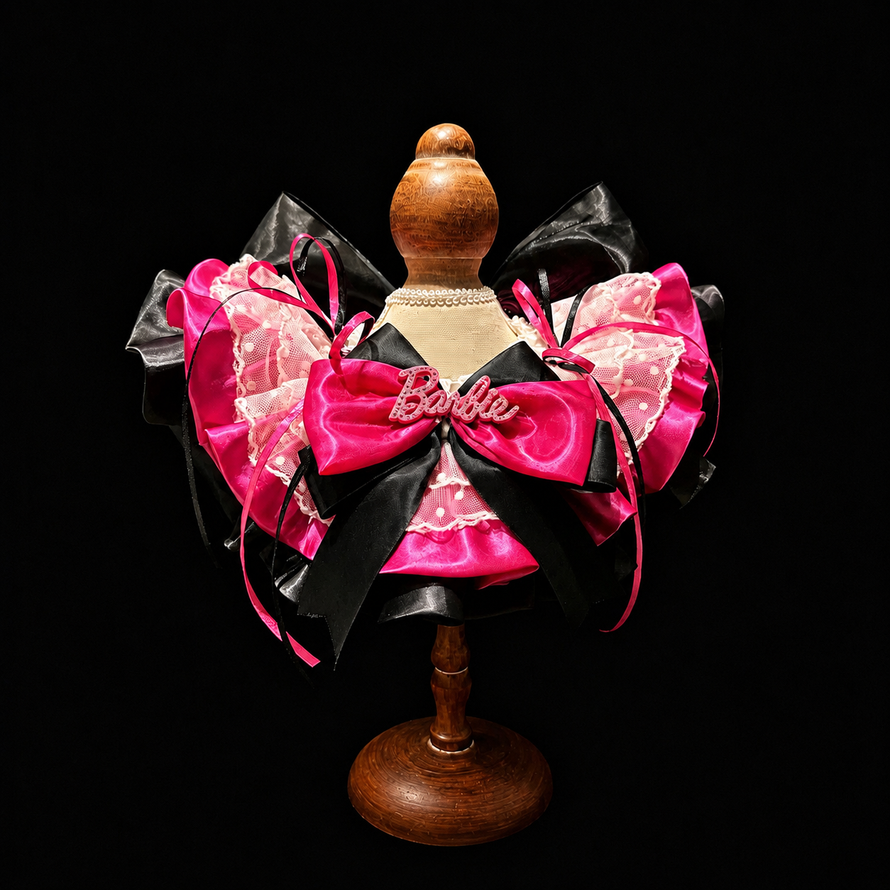 Babi satin lace pet bib collar on a mannequin with hot pink and black bows