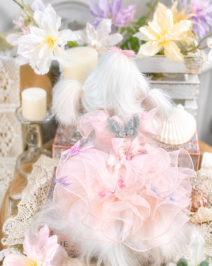 Rear view comparison of mint green and blush pink butterfly dog dresses showing breathable design and layered tulle construction