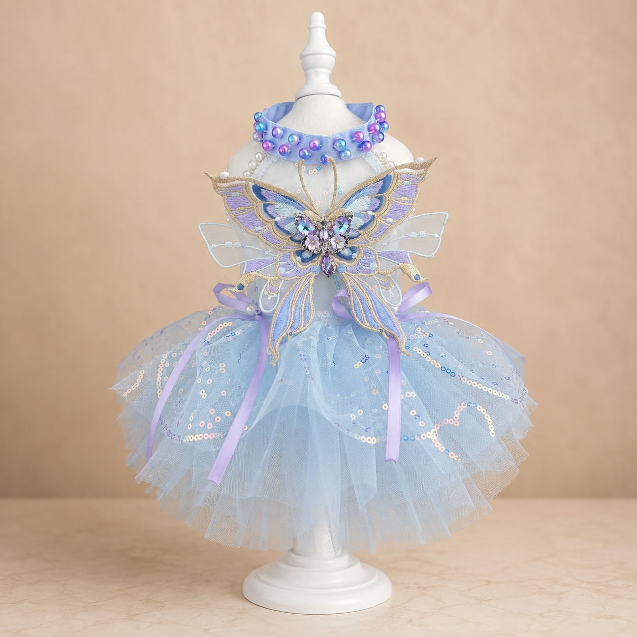 Blue butterfly tulle pet dress front view with beaded collar and short skirt