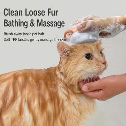 Pet bath brush with soft TPR bristles used on a wet cat during bathing