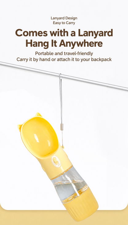 Yellow portable dog and cat water bottle hanging from its included wrist lanyard